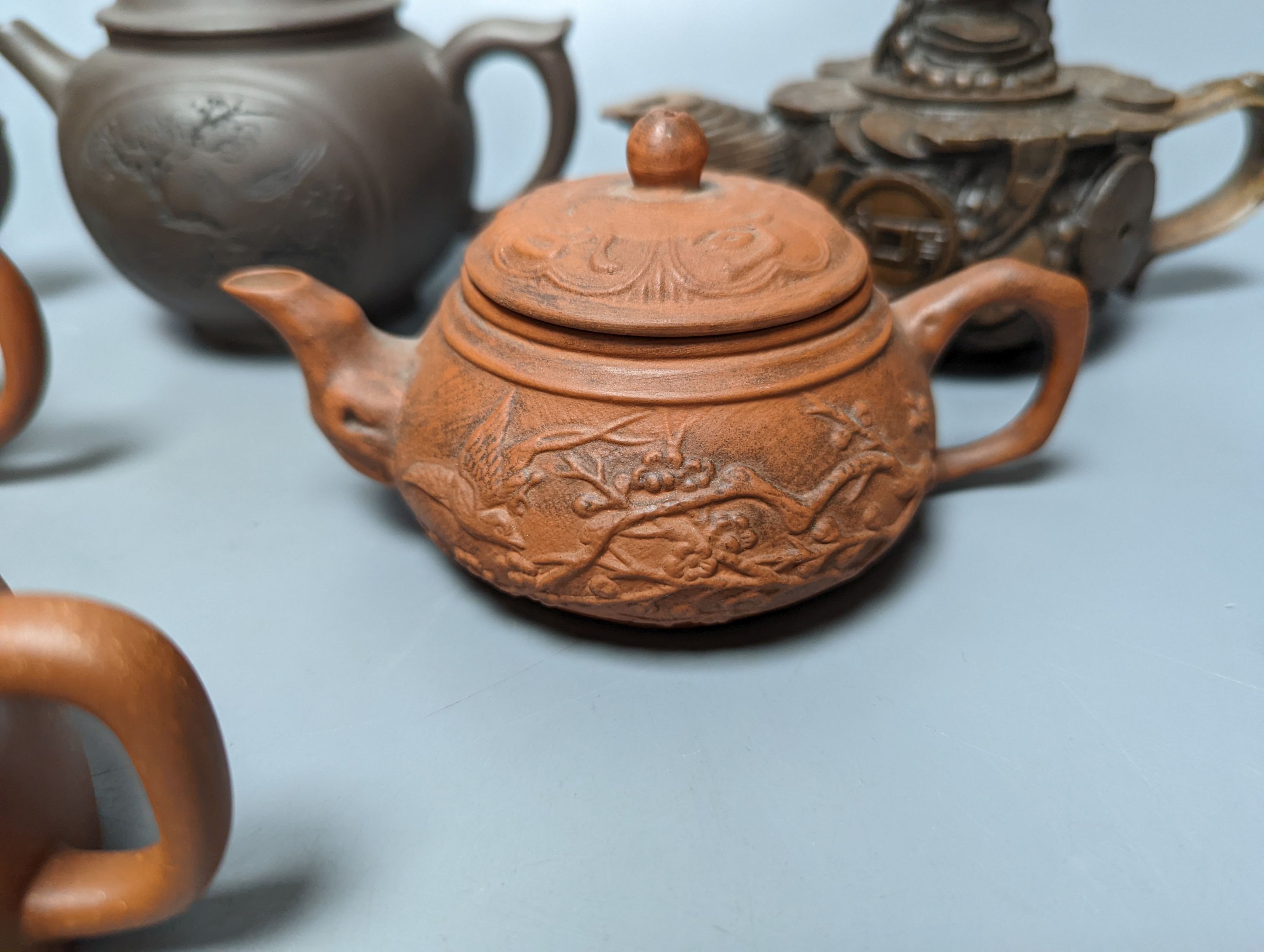 A Chinese stoneware 'cash' teapot and cover and five Yixing teapots (6)